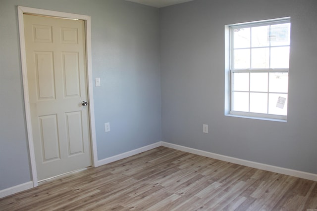 spare room featuring light wood-type flooring