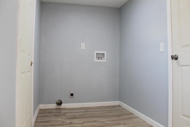 washroom featuring hookup for a washing machine, light wood-type flooring, and electric dryer hookup