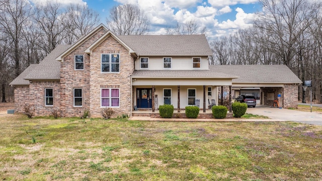 view of front of home with covered porch, a front yard, and a carport