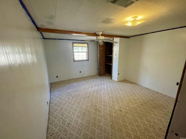 unfurnished room featuring light colored carpet and ceiling fan