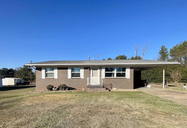 view of front facade with a carport and a front yard