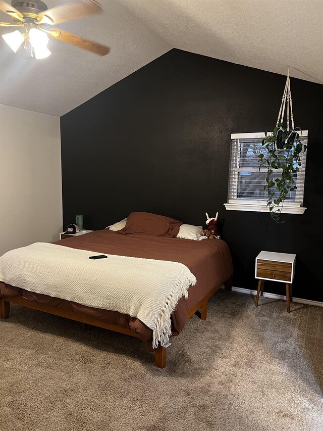 bedroom featuring ceiling fan, lofted ceiling, and carpet floors