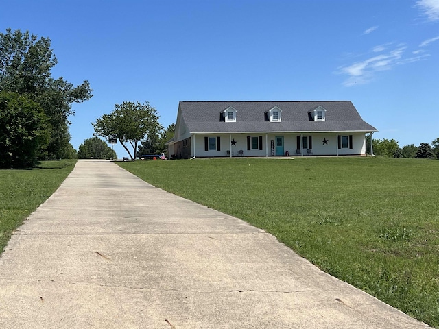 view of front of house featuring covered porch and a front yard