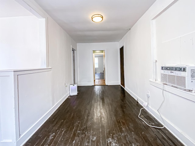 hall with dark hardwood / wood-style flooring