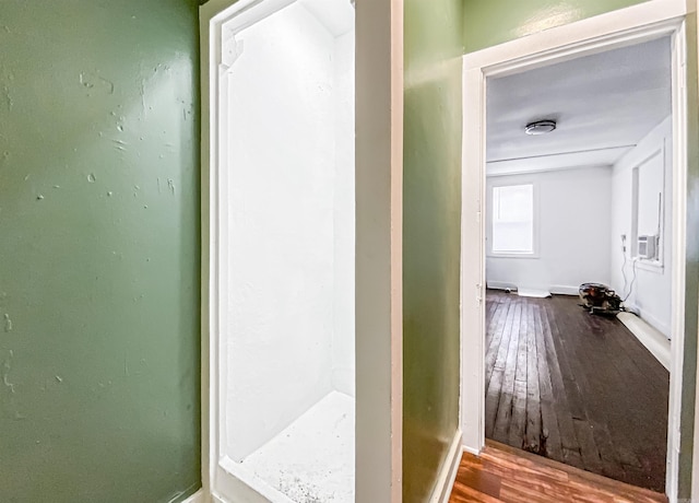 bathroom with hardwood / wood-style flooring