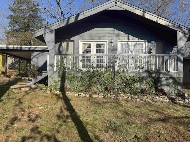 view of side of property with a yard