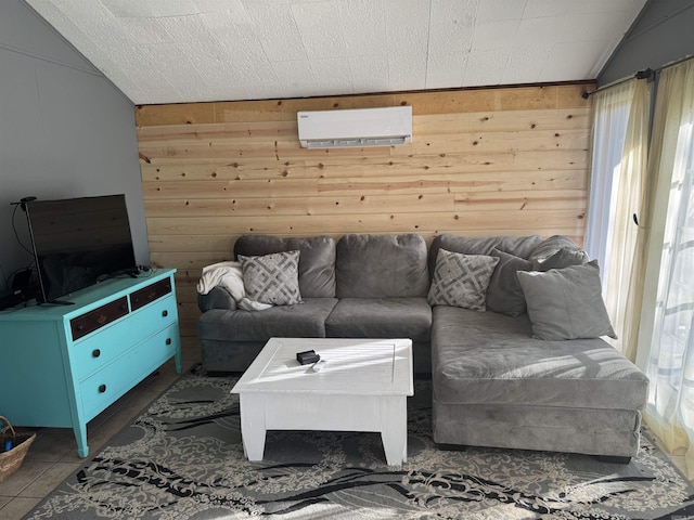 living room with a wall mounted air conditioner, vaulted ceiling, and wooden walls