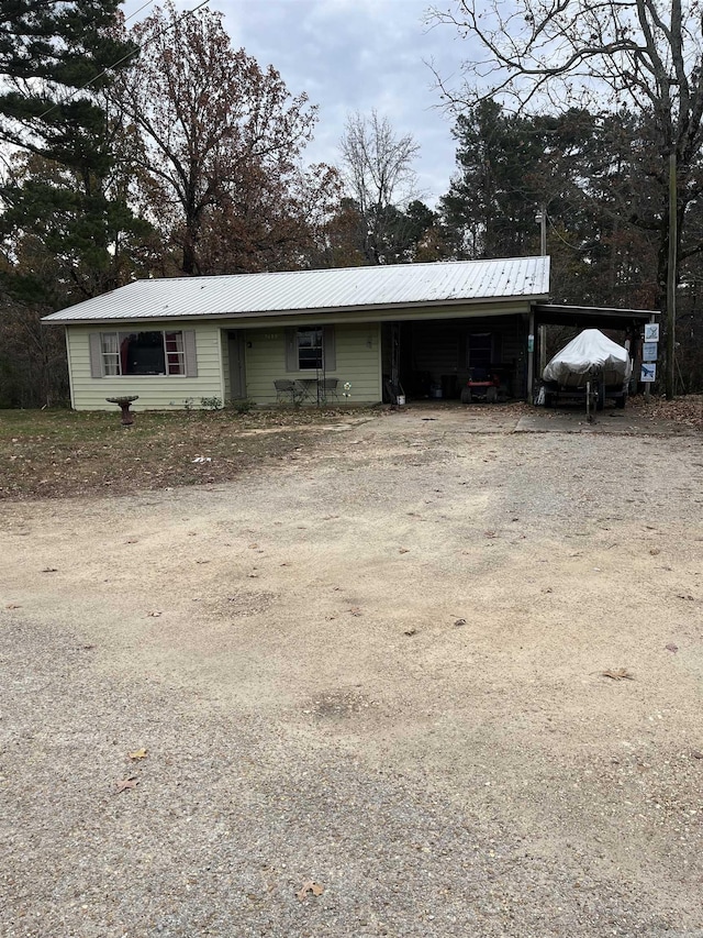 view of outbuilding featuring a carport