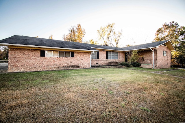 rear view of property with a yard