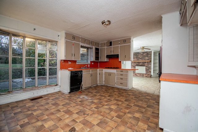 kitchen with a textured ceiling, gas stovetop, ceiling fan, black dishwasher, and gray cabinets