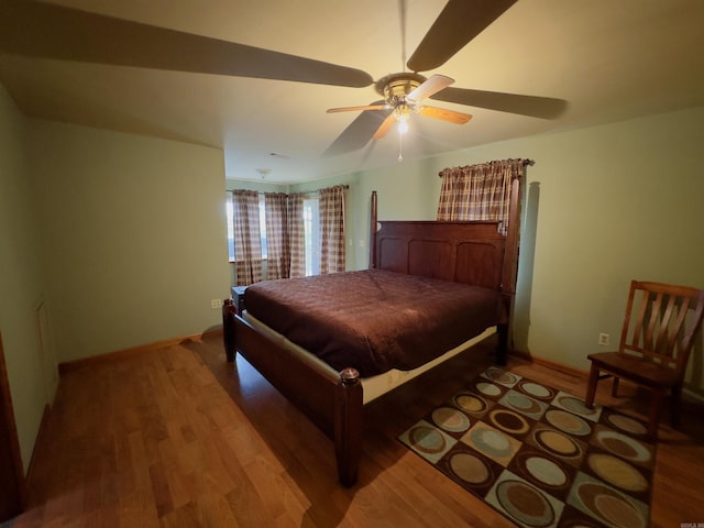 bedroom with hardwood / wood-style flooring and ceiling fan