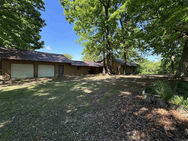 view of yard featuring a garage