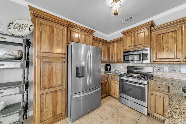 kitchen with appliances with stainless steel finishes, tasteful backsplash, light stone counters, and ornamental molding