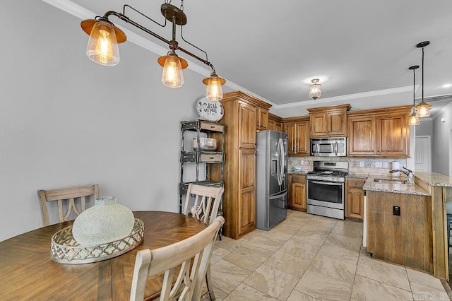 kitchen with backsplash, light stone counters, crown molding, and appliances with stainless steel finishes