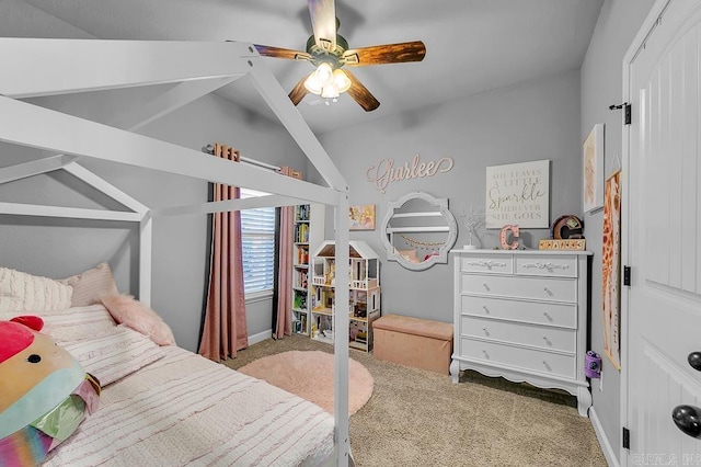 bedroom featuring ceiling fan, light colored carpet, and vaulted ceiling