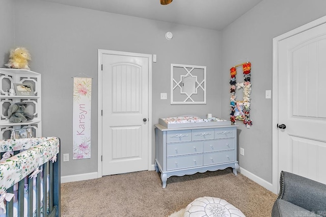 bedroom featuring light colored carpet