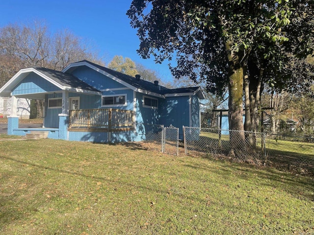 exterior space featuring a lawn and covered porch