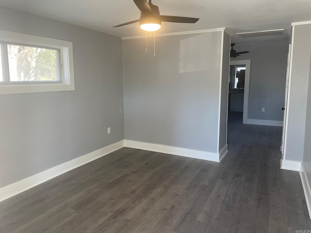 empty room featuring dark hardwood / wood-style floors and ceiling fan