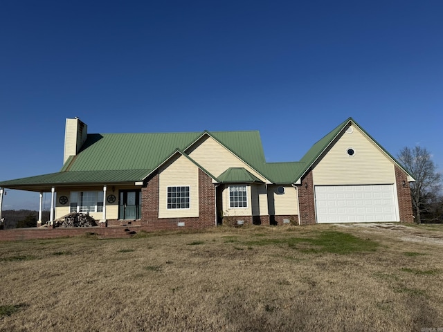 view of front facade with a porch, a garage, and a front yard