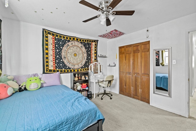 bedroom with ceiling fan, a closet, and carpet floors