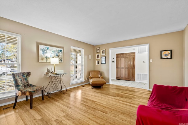 sitting room featuring light hardwood / wood-style flooring