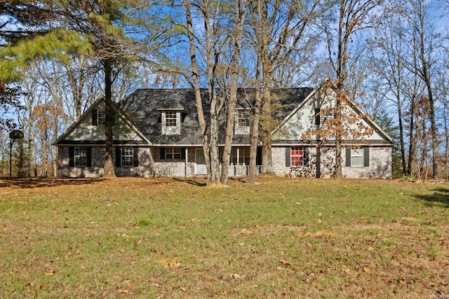 new england style home with a front lawn