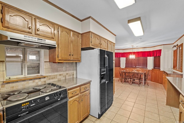 kitchen featuring electric range, tasteful backsplash, refrigerator with ice dispenser, decorative light fixtures, and light tile patterned flooring