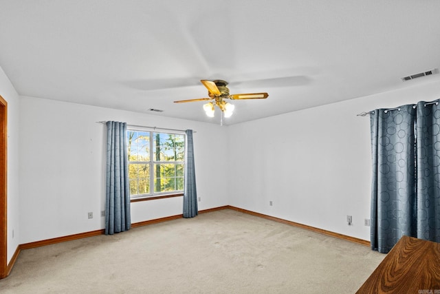 carpeted empty room with ceiling fan