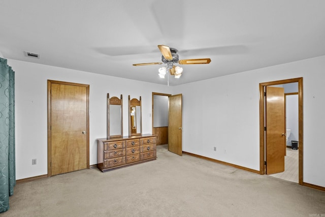 unfurnished bedroom featuring ceiling fan and light carpet