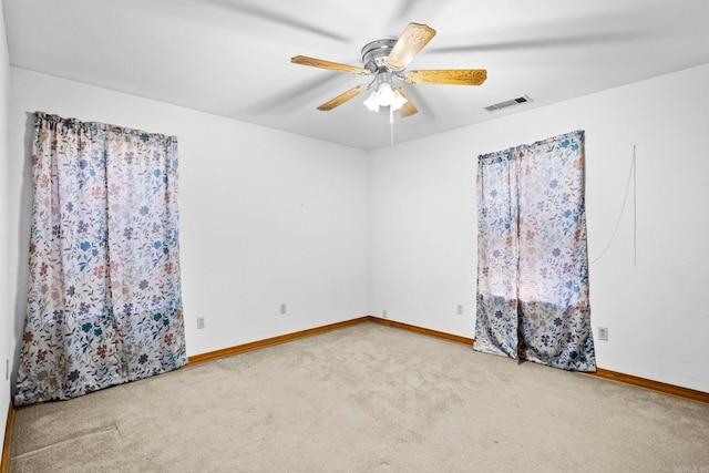 unfurnished room featuring carpet floors and ceiling fan