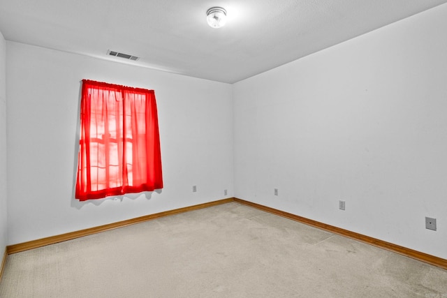 spare room featuring carpet floors