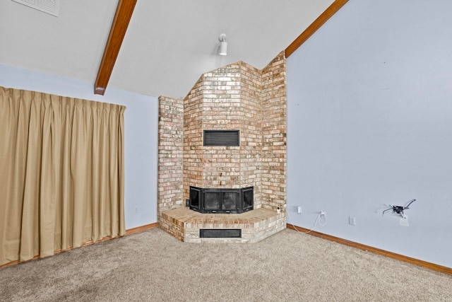 unfurnished living room with carpet flooring and lofted ceiling with beams