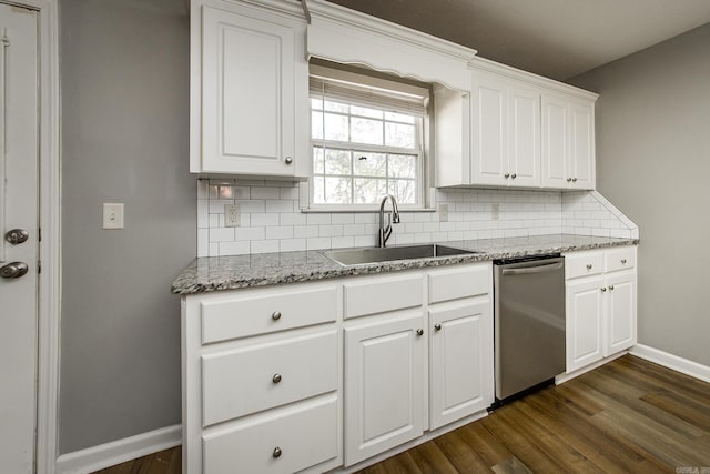 kitchen featuring sink, stainless steel dishwasher, decorative backsplash, dark hardwood / wood-style flooring, and white cabinetry