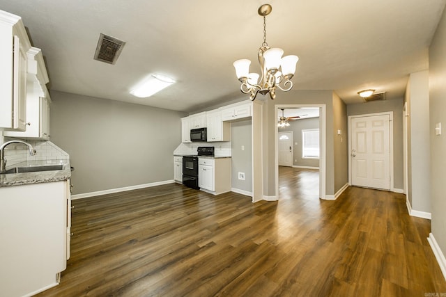 kitchen with black appliances, white cabinets, sink, decorative backsplash, and dark hardwood / wood-style floors