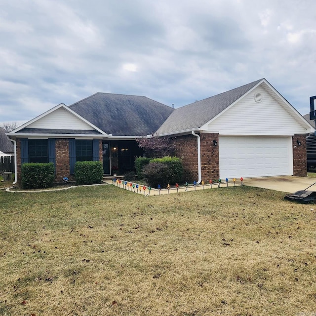 ranch-style house featuring a garage and a front lawn