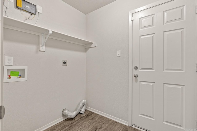 washroom with hookup for a washing machine, dark hardwood / wood-style flooring, and electric dryer hookup