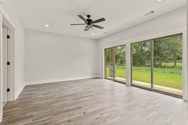 unfurnished room featuring light hardwood / wood-style flooring and ceiling fan