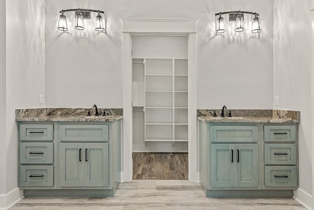 bathroom with hardwood / wood-style floors and vanity