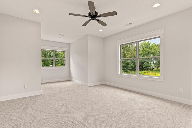 empty room with light carpet and ceiling fan