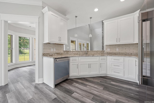 kitchen featuring white cabinets, sink, appliances with stainless steel finishes, and tasteful backsplash