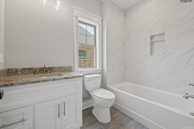 full bathroom with toilet, vanity, tiled shower / bath combo, and hardwood / wood-style flooring