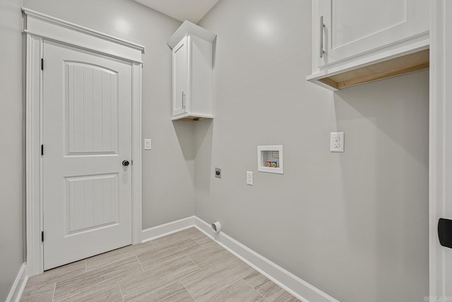 washroom featuring cabinets, washer hookup, and electric dryer hookup