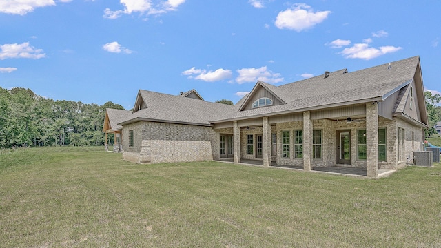 back of house with a yard, a patio, ceiling fan, and cooling unit