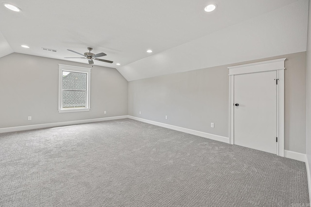 additional living space with ceiling fan, carpet floors, and vaulted ceiling