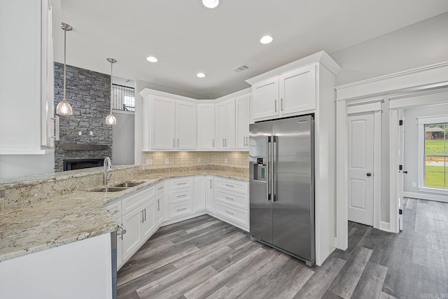 kitchen with white cabinets, decorative light fixtures, dark hardwood / wood-style flooring, and high end refrigerator