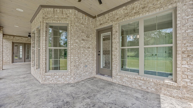 entrance to property featuring ceiling fan