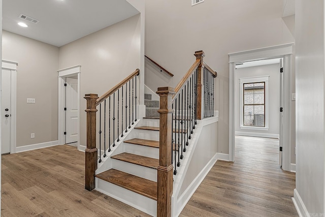 stairway featuring hardwood / wood-style flooring