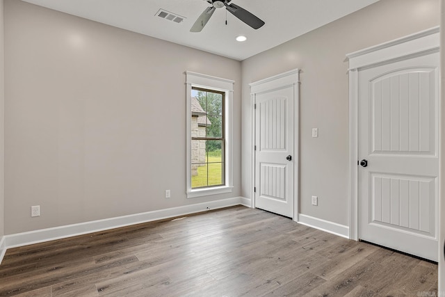 unfurnished bedroom featuring ceiling fan and light wood-type flooring