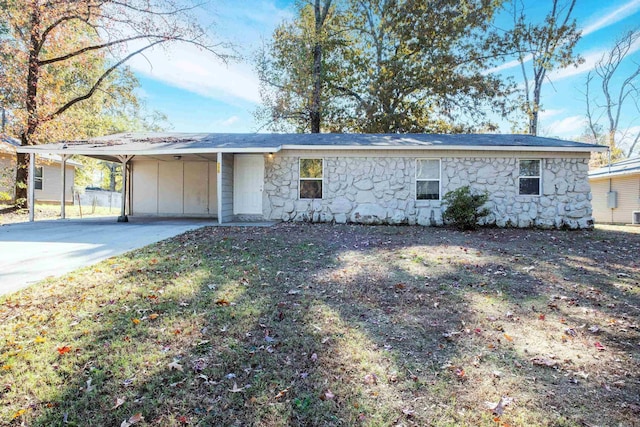 ranch-style home featuring a carport