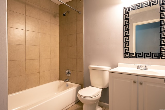 full bathroom featuring tile patterned floors, vanity, tiled shower / bath combo, and toilet